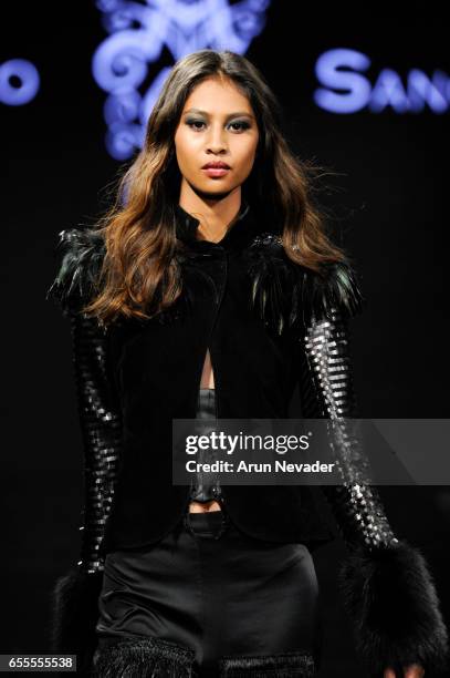 Model walks the runway wearing Adolfo Sanchez at the Art Hearts Fashion LAFW Fall/Winter 2017-Day 4 at The Beverly Hilton Hotel on March 17, 2017 in...