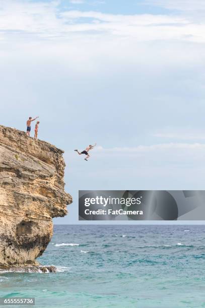 hawaii cliff jumping - cliff diving stock pictures, royalty-free photos & images