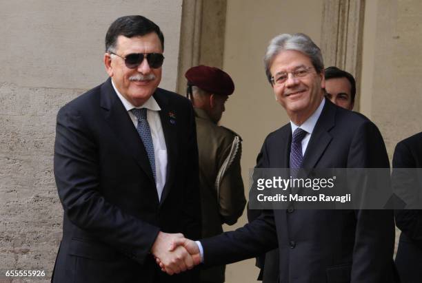 Italian Prime Minister Paolo Gentiloni welcomes Libyan Prime Minister Fayez al-Sarraj for a meeting at the Chigi Palace on March 20, 2017 in Rome,...