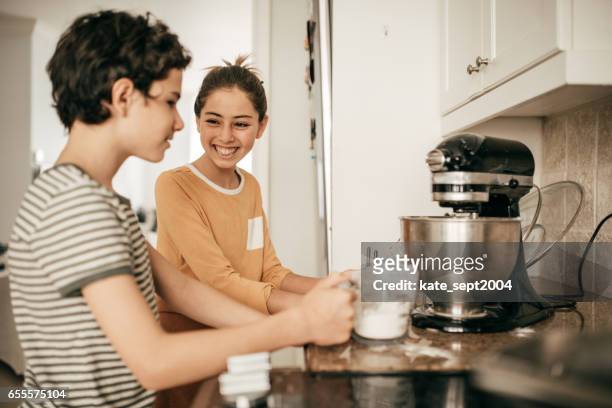 baking kids - boy cooking stock pictures, royalty-free photos & images