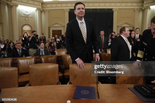 James Comey, director of the Federal Bureau of Investigation , center, arrives for a House Intelligence Committee hearing in Washington, D.C., U.S.,...