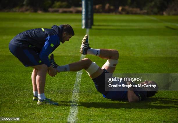 Leinster , Ireland - 20 March 2017; Leinster's Mike McCarthy stretches with the help of Leinster senior rehabilitation coach Diarmuid Brennan during...