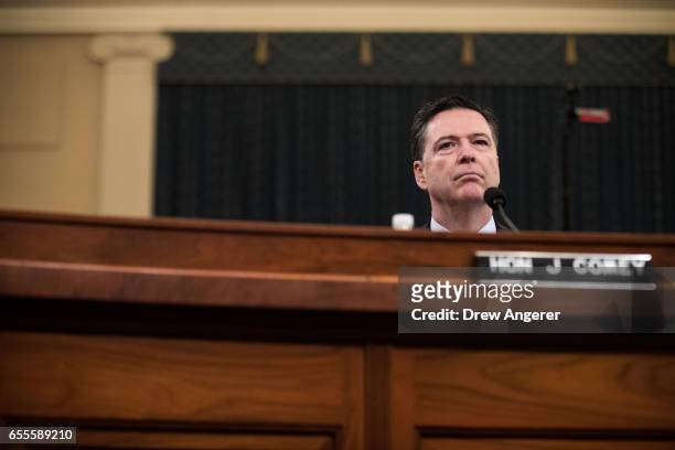 James Comey, Director of the Federal Bureau of Investigation , listens to opening statements from the chairman during a House Permanent Select...