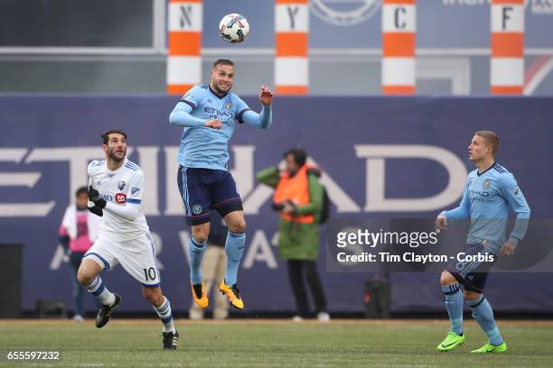 March 18: Maxime Chanot of New York City FC heads clear from Ignacio Piatti of Montreal Impact during the New York City FC Vs Montreal Impact regular...