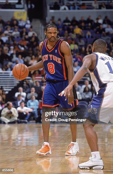Latrell Sprewell of the New York Knicks dribbles the ball as he is guarded by Chris Whitney of the Washington Wizards at the MCI Center in...
