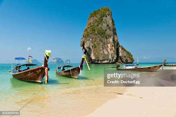 tourists boat at ao phra nang beach in sunny day - poda stock pictures, royalty-free photos & images