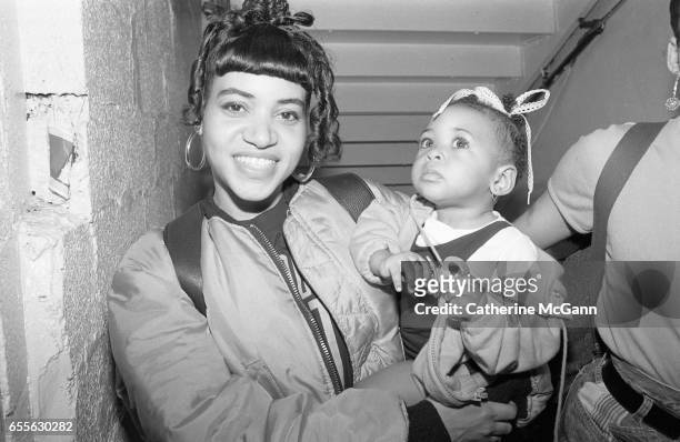 Rapper Cheryl 'Salt' James of Salt-n-Pepa poses for a photo holding her baby in the 1990s in New York City, New York.