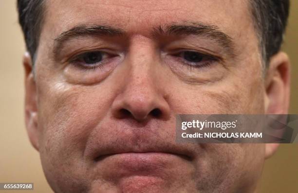 Director James Comey looks on during the House Permanent Select Committee on Intelligence hearing on Russian actions during the 2016 election...