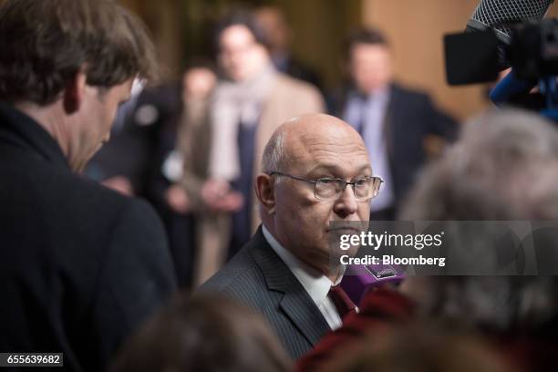 Michel Sapin, France's finance minister, speaks to reporters as he arrives for a Eurogroup meeting of finance ministers in Brussels, Belgium, on...