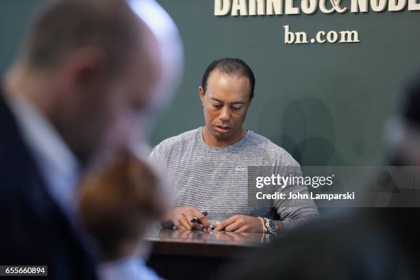 Professional golf player, Tiger Woods signs copies of his new book "The 1997 Masters: My Story" at Barnes & Noble Union Square on March 20, 2017 in...