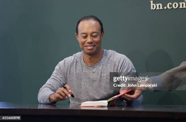 Professional golf player, Tiger Woods signs copies of his new book "The 1997 Masters: My Story" at Barnes & Noble Union Square on March 20, 2017 in...