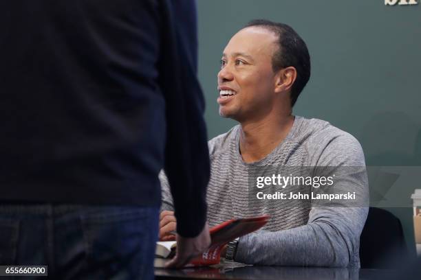 Professional golf player, Tiger Woods signs copies of his new book "The 1997 Masters: My Story" at Barnes & Noble Union Square on March 20, 2017 in...