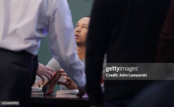 Professional golf player, Tiger Woods signs copies of his new book "The 1997 Masters: My Story" at Barnes & Noble Union Square on March 20, 2017 in...