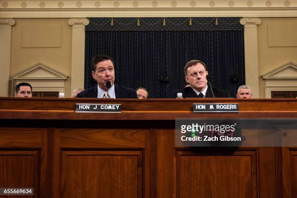 James Comey, Director of the Federal Bureau of Investigation , and Michael Rogers, Director of the National Security Agency, testify during a House...