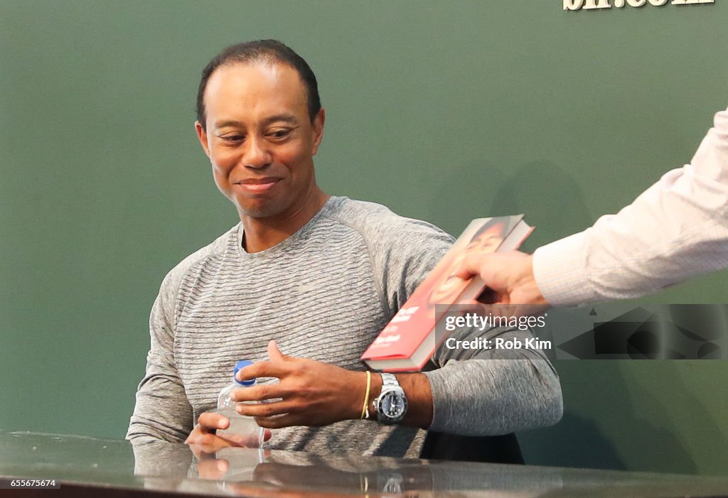 Tiger Woods Signs Copies Of His New Book "The 1997 Masters: My Story"