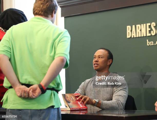 Tiger Woods signs copies of his new book, "The 1997 Masters: My Story" at Barnes & Noble Union Square on March 20, 2017 in New York City.