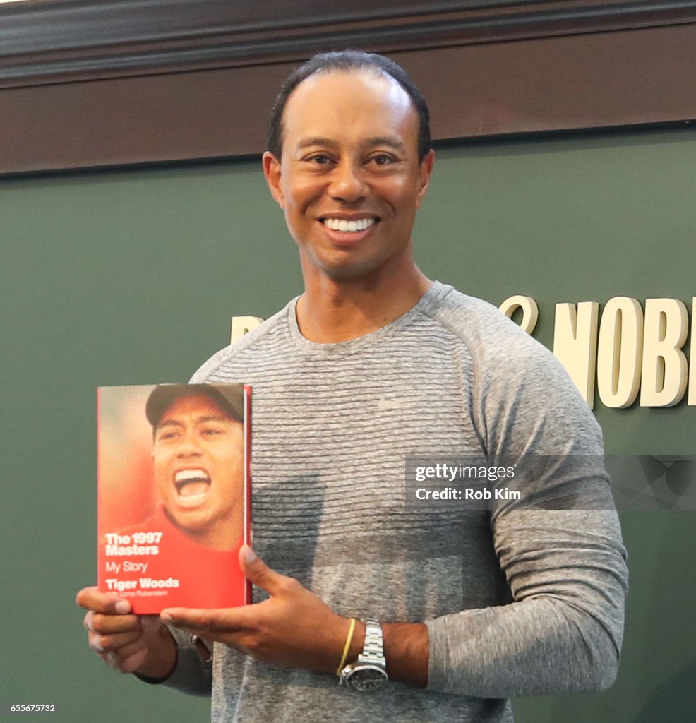 Tiger Woods Signs Copies Of His New Book "The 1997 Masters: My Story"