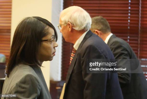 Orange/Osceola State Attorney Aramis Ayala, left, leaves the courtroom after asking for Markeith Loyd's case to pause Monday, March 20, 2017 while...