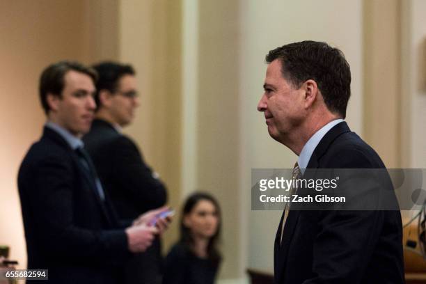 James Comey, Director of the Federal Bureau of Investigation , leaves the room for a break during a House Permanent Select Committee on Intelligence...