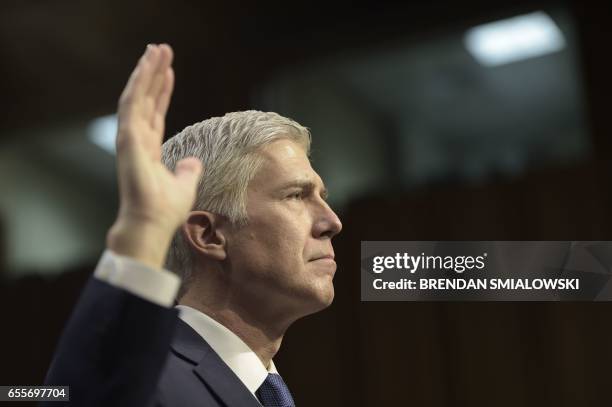 Neil Gorsuch takes an oath during his Senate Judiciary Committee confirmation hearing as US President Donald Trump's nominee for the Supreme Court on...