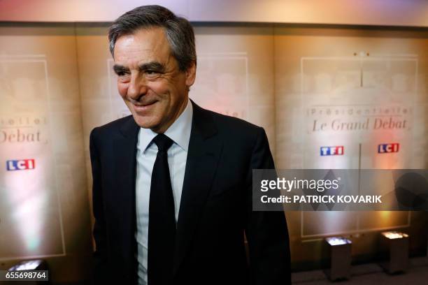 French presidential election candidate for the right-wing Les Republicains party Francois Fillon arrives for a debate organised by French private TV...