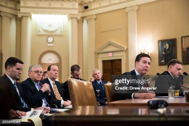 James Comey, Director of the Federal Bureau of Investigation , and Michael Rogers, Director of the National Security Agency, testify during a House...