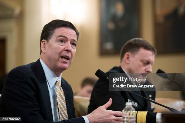 James Comey, Director of the Federal Bureau of Investigation , and Michael Rogers, Director of the National Security Agency, testify during a House...