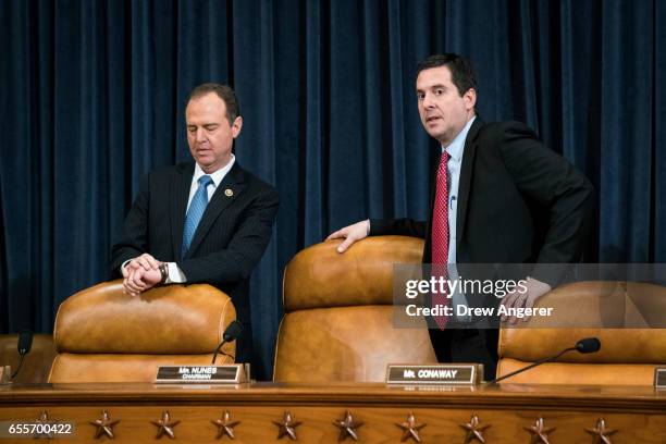 Ranking member Rep. Adam Schiff and chairman Rep. Devin Nunes prepare to take their seats after a break during a House Permanent Select Committee on...