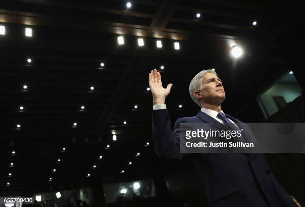 Judge Neil Gorsuch is sworn in on the first day of his Supreme Court confirmation hearing before the Senate Judiciary Committee in the Hart Senate...