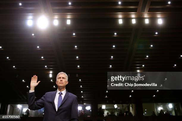 Judge Neil Gorsuch is sworn in during the first day of his Supreme Court confirmation hearing before the Senate Judiciary Committee in the Hart...
