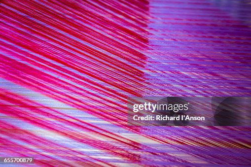 Detail of silk threads on carpet loom Detail of silk threads on carpet loom