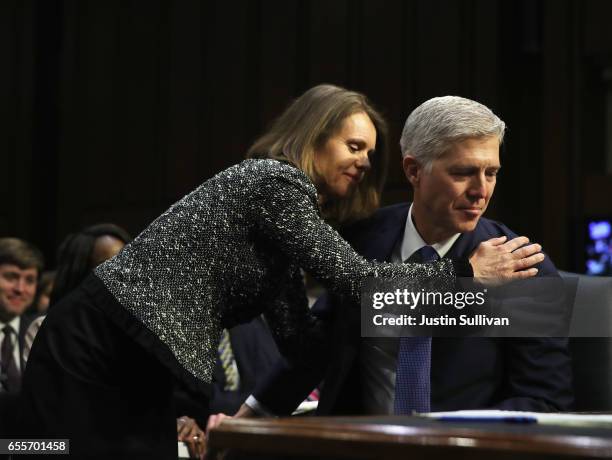 Marie Louise Gorsuch and Judge Neil Gorsuch embrace during the first day of his Supreme Court confirmation hearing before the Senate Judiciary...