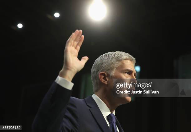 Judge Neil Gorsuch is sworn in on the first day of his Supreme Court confirmation hearing before the Senate Judiciary Committee in the Hart Senate...