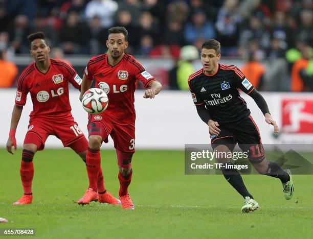 Karim Bellarabi of Leverkusen and Ivo Ilievi of Hamburg battle for the balll during the Bundesliga match between Bayer 04 Leverkusen and Hamburger SV...