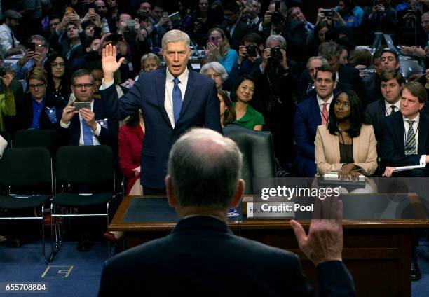 Senate Judiciary Committee Chairman Charles Grassley swears in Judge Neil Gorsuch during the first day of his Supreme Court confirmation hearing...