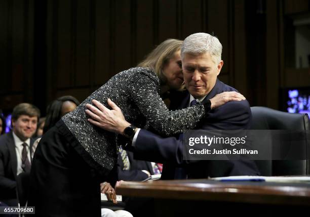 Marie Louise Gorsuch and Judge Neil Gorsuch embrace during the first day of his Supreme Court confirmation hearing before the Senate Judiciary...