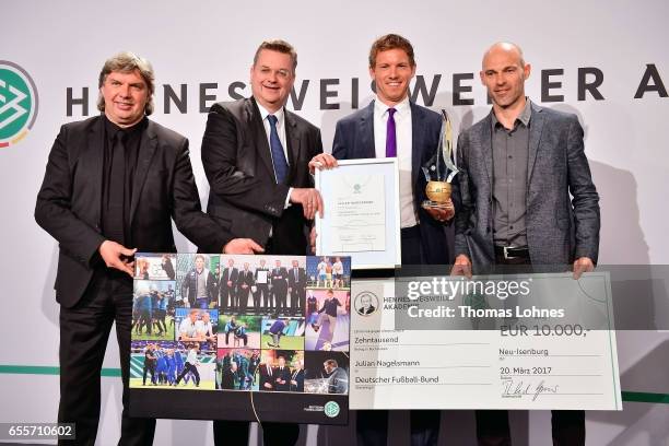 Julian Nagelsmann , the head coach of TSG 1899 Hoffenheim, gets the award 'Coach Of The Year 2016' from DFB vice president Ronny Zimmermann, DFB...