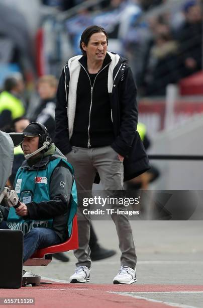 Head coach Roger Schmidt of Leverkusen gestures during the Bundesliga match between Bayer 04 Leverkusen and Hamburger SV at BayArena on April 4, 2015...