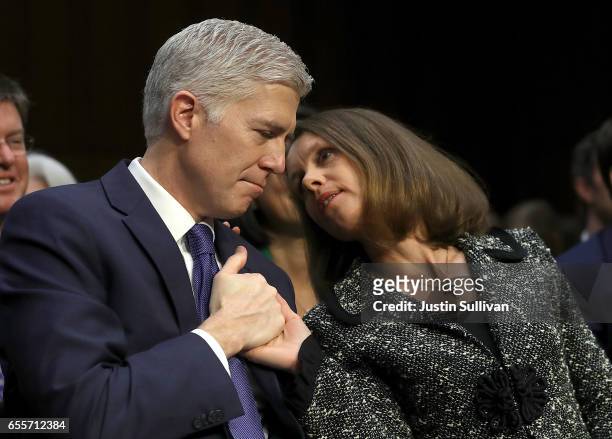 Marie Louise , and Judge Neil Gorsuch embrace during the first day of his Supreme Court confirmation hearing before the Senate Judiciary Committee in...