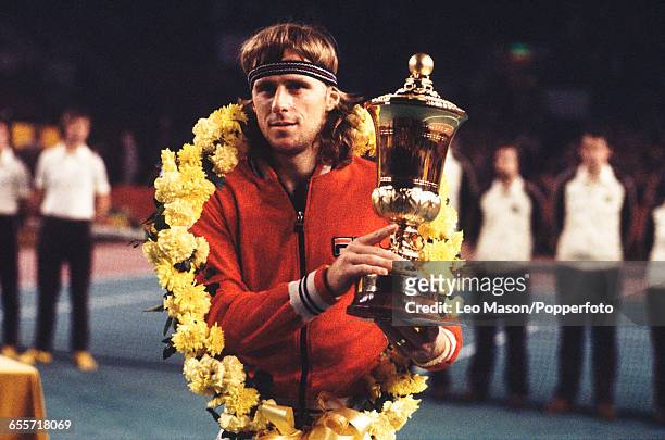 Swedish tennis player Bjorn Borg holds up the Benson & Hedges Championships Trophy after defeating John Lloyd 6-4, 6-4, 6-3 in the final of the Men's...