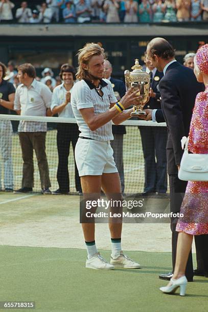 Swedish tennis player Bjorn Borg pictured being presented with the Gentlemen's Singles Trophy by Prince Edward, Duke of Kent and Katharine, Duchess...