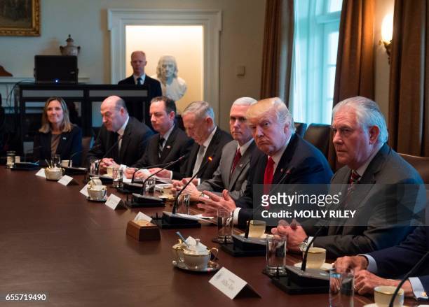 President Donald Trump listens next to Vice President Mike Pence and Secretary of State Rex Tillerson while Iraqi Prime Minister Haider Al-Abadi...
