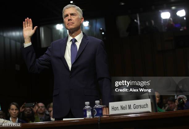 Judge Neil Gorsuch is sworn in during the first day of his Supreme Court confirmation hearing before the Senate Judiciary Committee in the Hart...