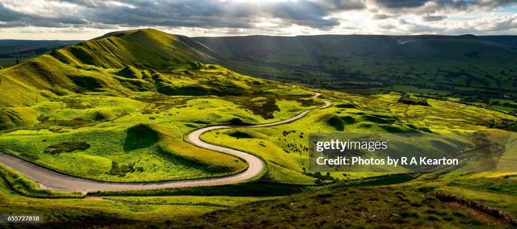 Road winding through green hills