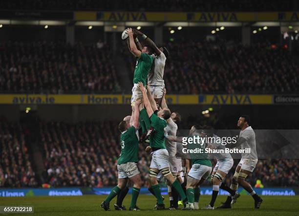 Peter O'Mahony of Ireland wins the line-out ball from Maro Itoje of England late in the game during the RBS Six Nations match between Ireland and...