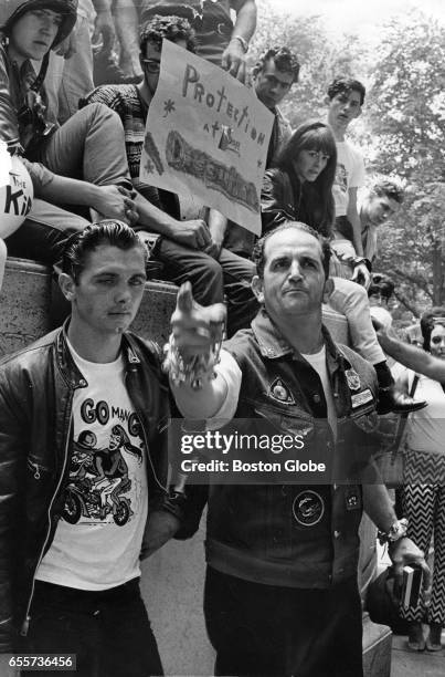 Maurice Fuoco of Hyde Park, president of the Red Emeralds Motorcycle Club of Boston, speaks during a "helmet-in" protest against a newly-enacted...