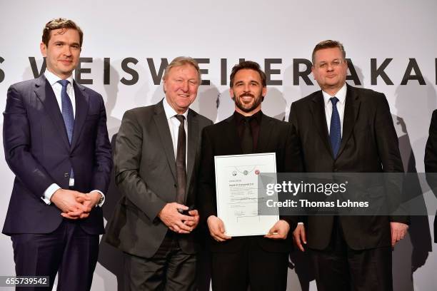 The new DFB football coach Damir Dugandzic stands with his certificate between DFB general secretary Friedrich Curtius, Horst Hrubesch and DFB...