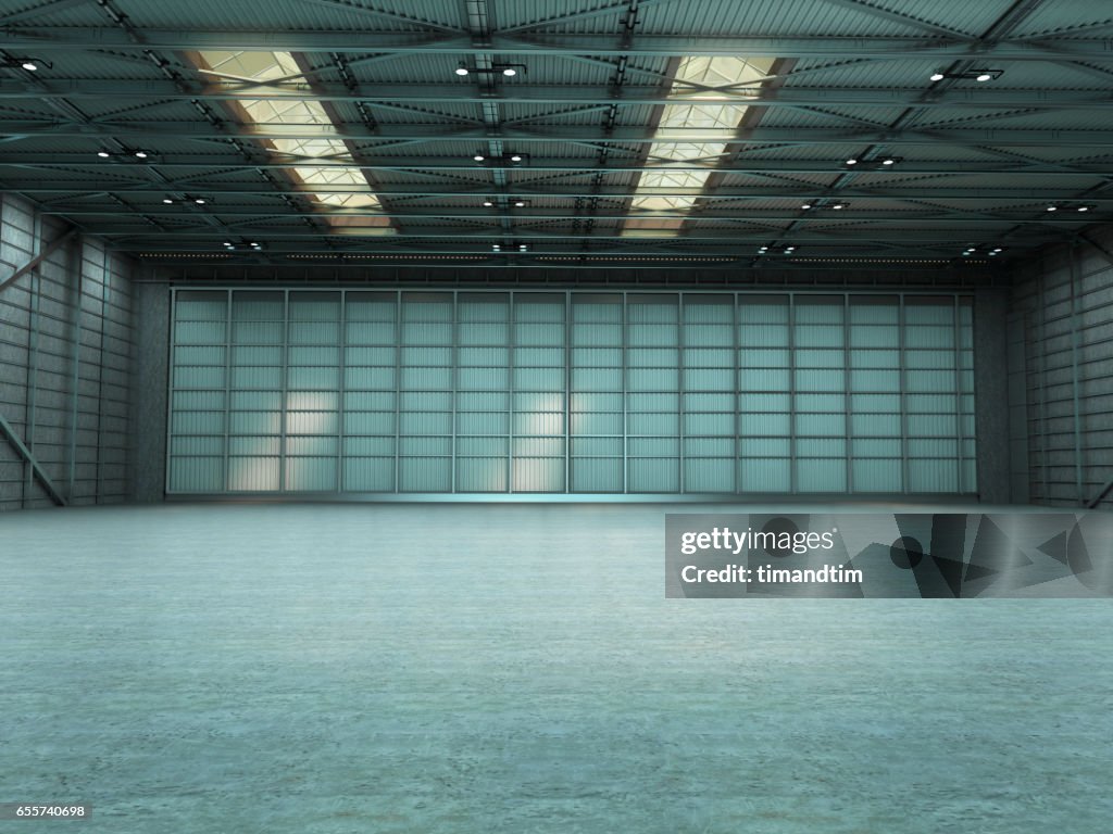 Empty warehouse by day with doors closed