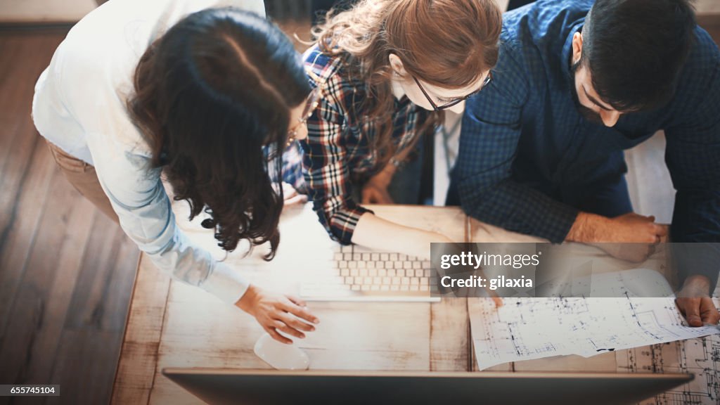 Graphic designers at their studio.