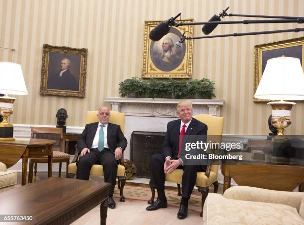 President Donald Trump, right, meets with Haider al-Abadi, Iraq's prime minister, at the White House in Washington, D.C., U.S., on Monday, March 20,...